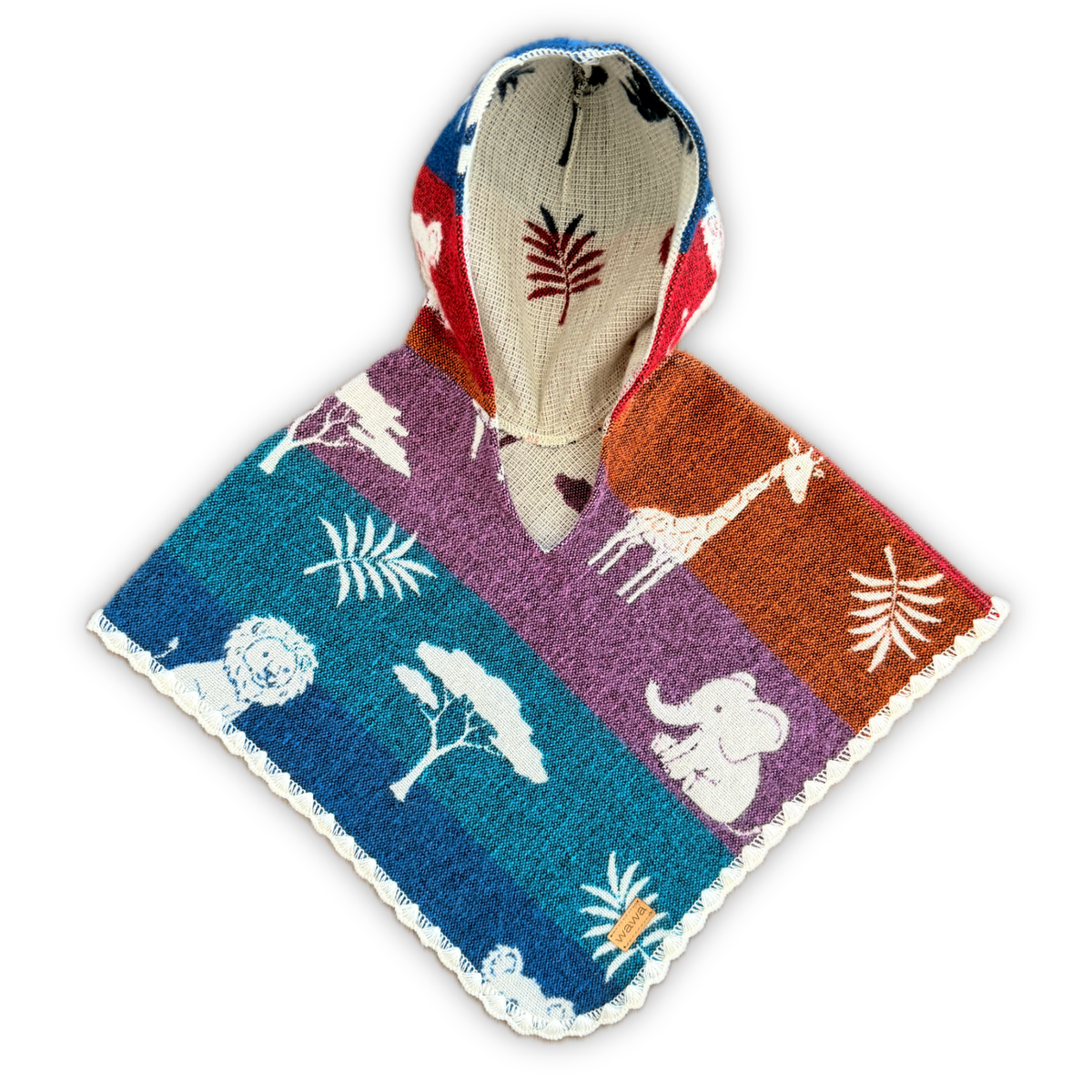 A hooded knit poncho with a colorful safari-themed print, featuring white animal silhouettes including a giraffe, elephant, lion, and acacia trees on blue, purple, and orange panels, with a beige hood lining.