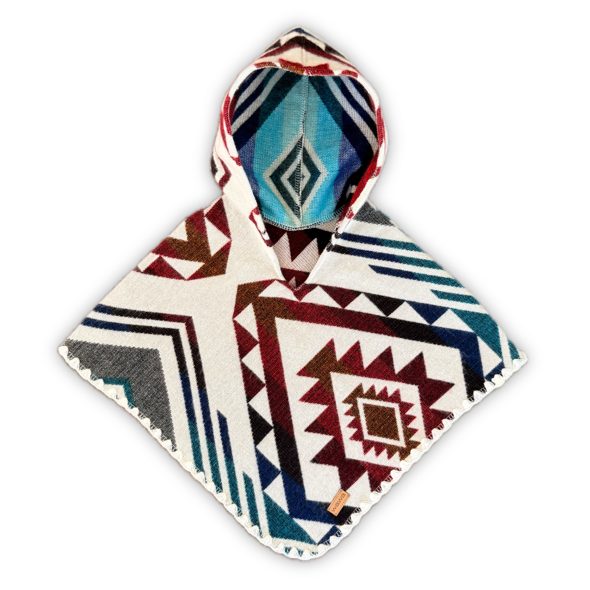 A hooded poncho with a Southwestern geometric pattern in cream, navy, red, and teal, displayed against a solid white background.