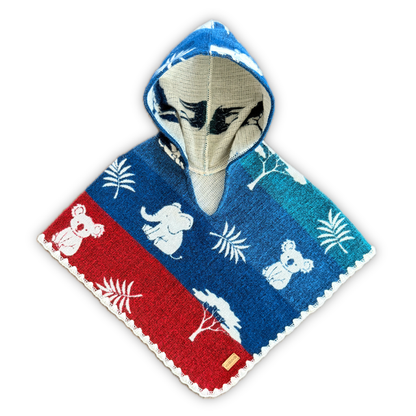 A hooded baby poncho with a colorful animal and plant pattern, featuring a red section with white koalas, a blue section with white elephants and palm leaves, and a beige hood with a black face motif, set against a plain white background.