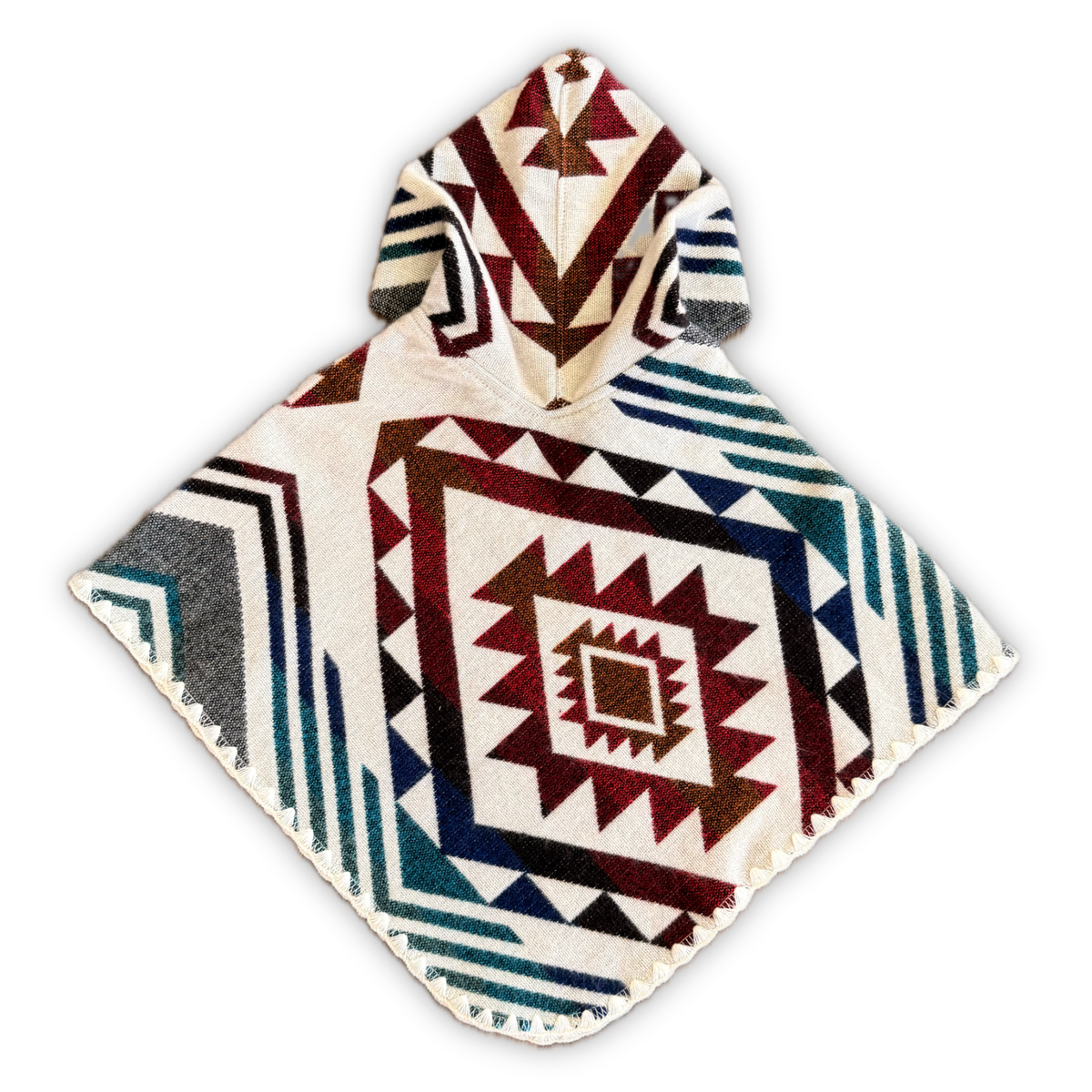 A hooded poncho with a Southwestern geometric pattern, featuring a cream base with red, blue, and brown tribal-style designs, shown on a plain white background.